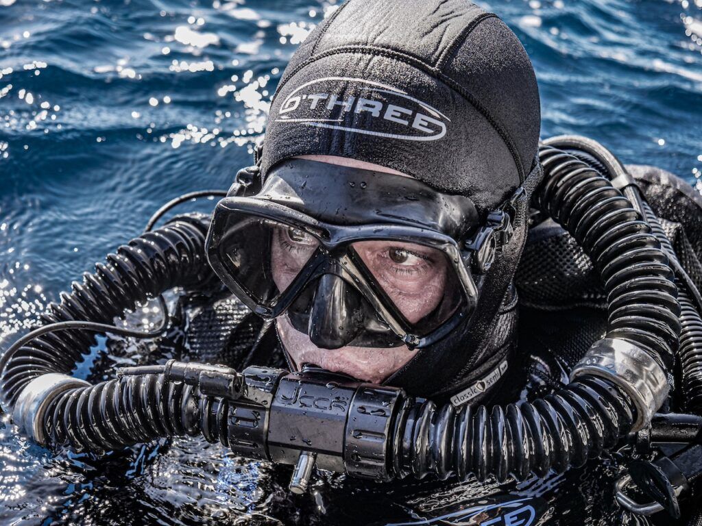 Technical diver in closed-circuit gear at the surface